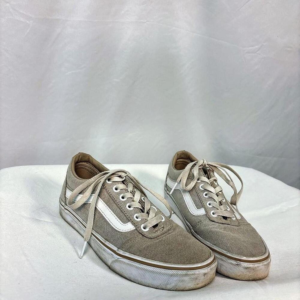 Grey and white Vans trainers
